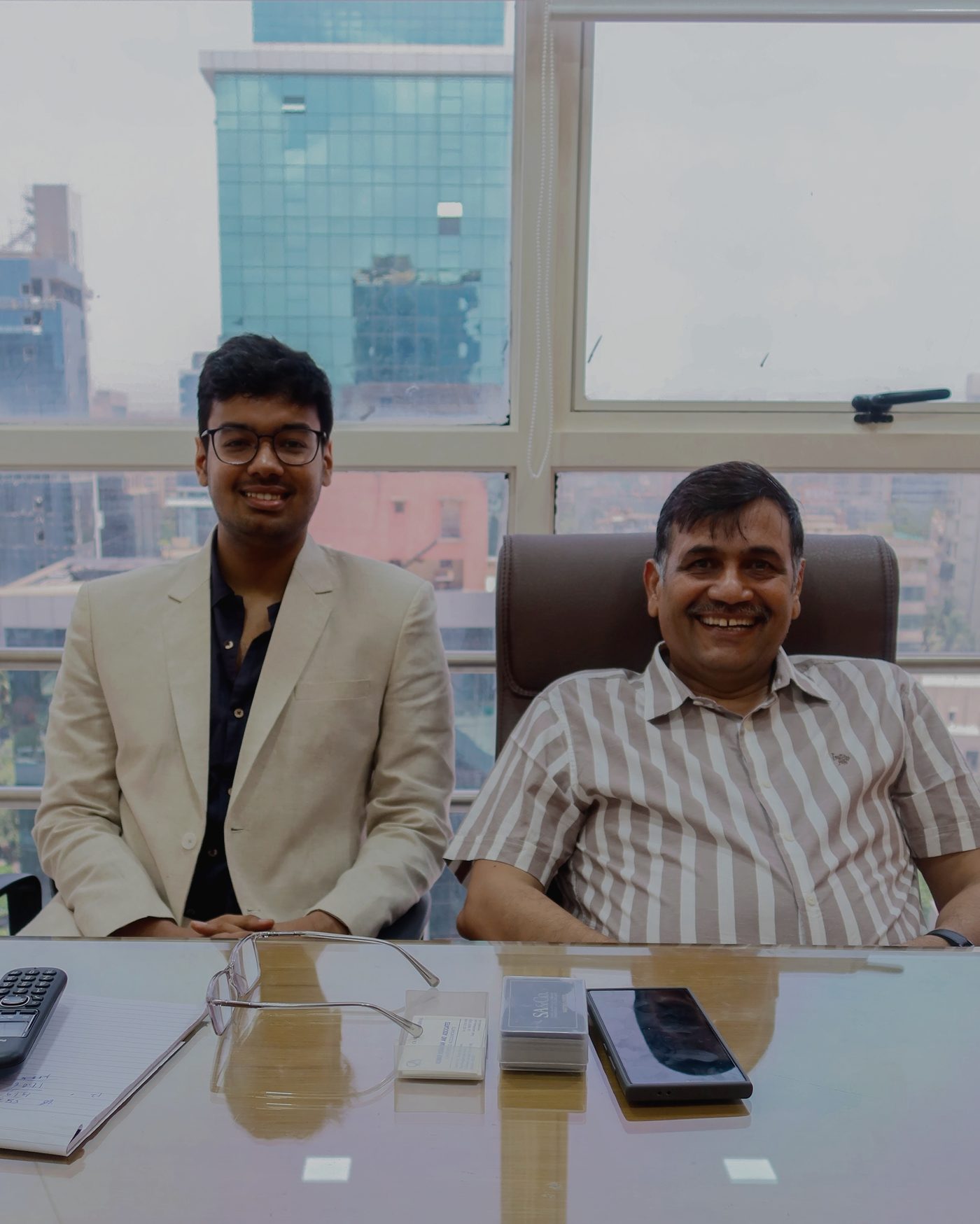 CA Sahil Agarwal and CA Niranjan Agarwal at their desk in the Andheri West office
